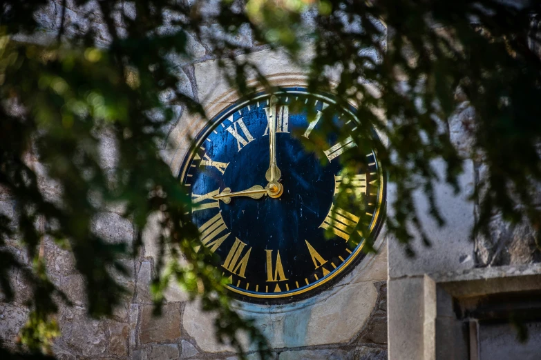 a clock on a wall with roman numerals