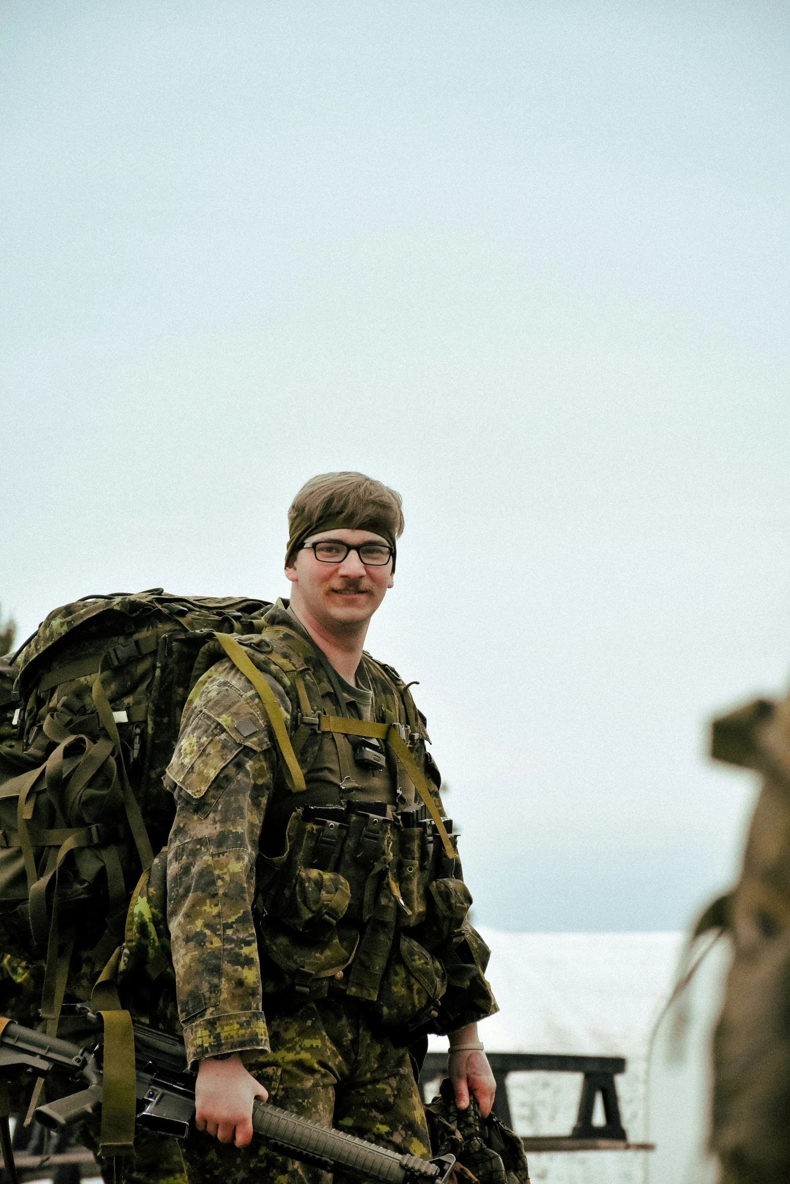 a man in camouflage on the front of a horse