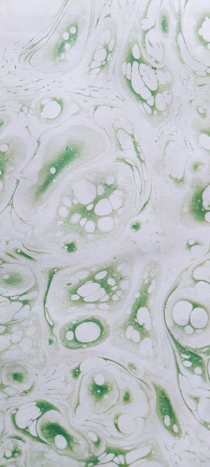 green and white swirled designs in water