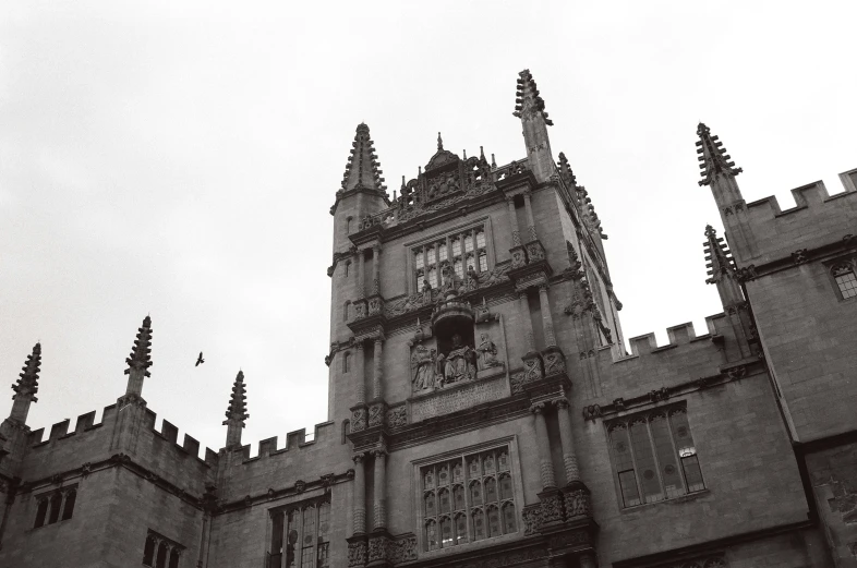 a black and white image of a castle clock tower