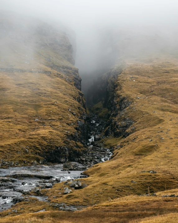 there is a mountain stream in the mountains