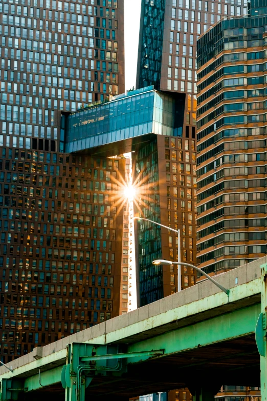 sunlight beaming over a bridge over a bridge with a sky background