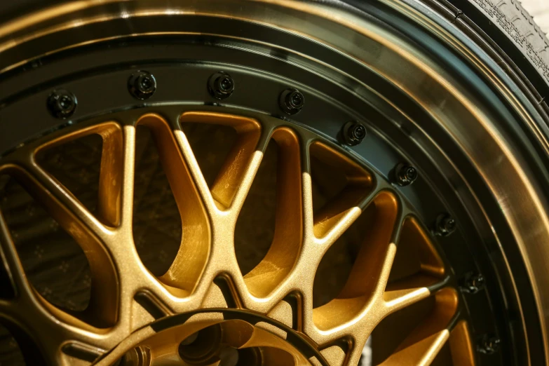 the wheels on a very shiny gold sports car