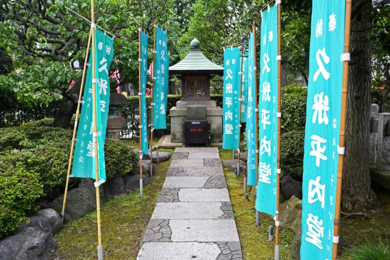 tea houses with blue green flags on either side