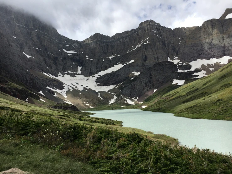 there are many mountains surrounding this small lake