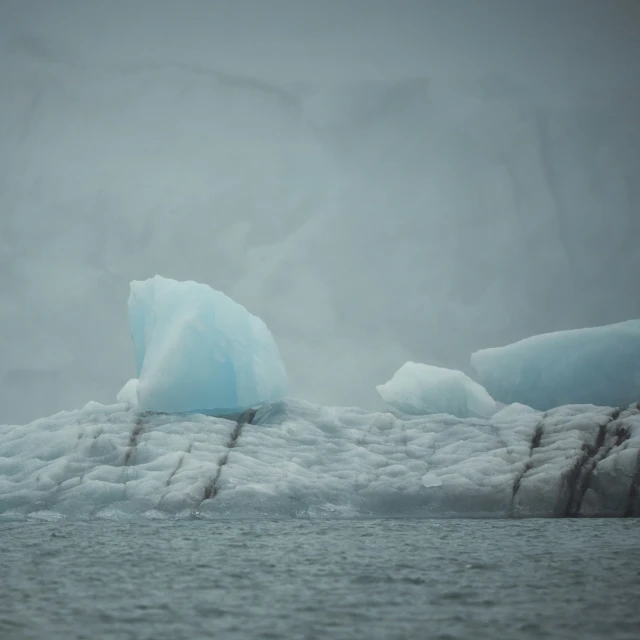 an iceberg in the middle of water