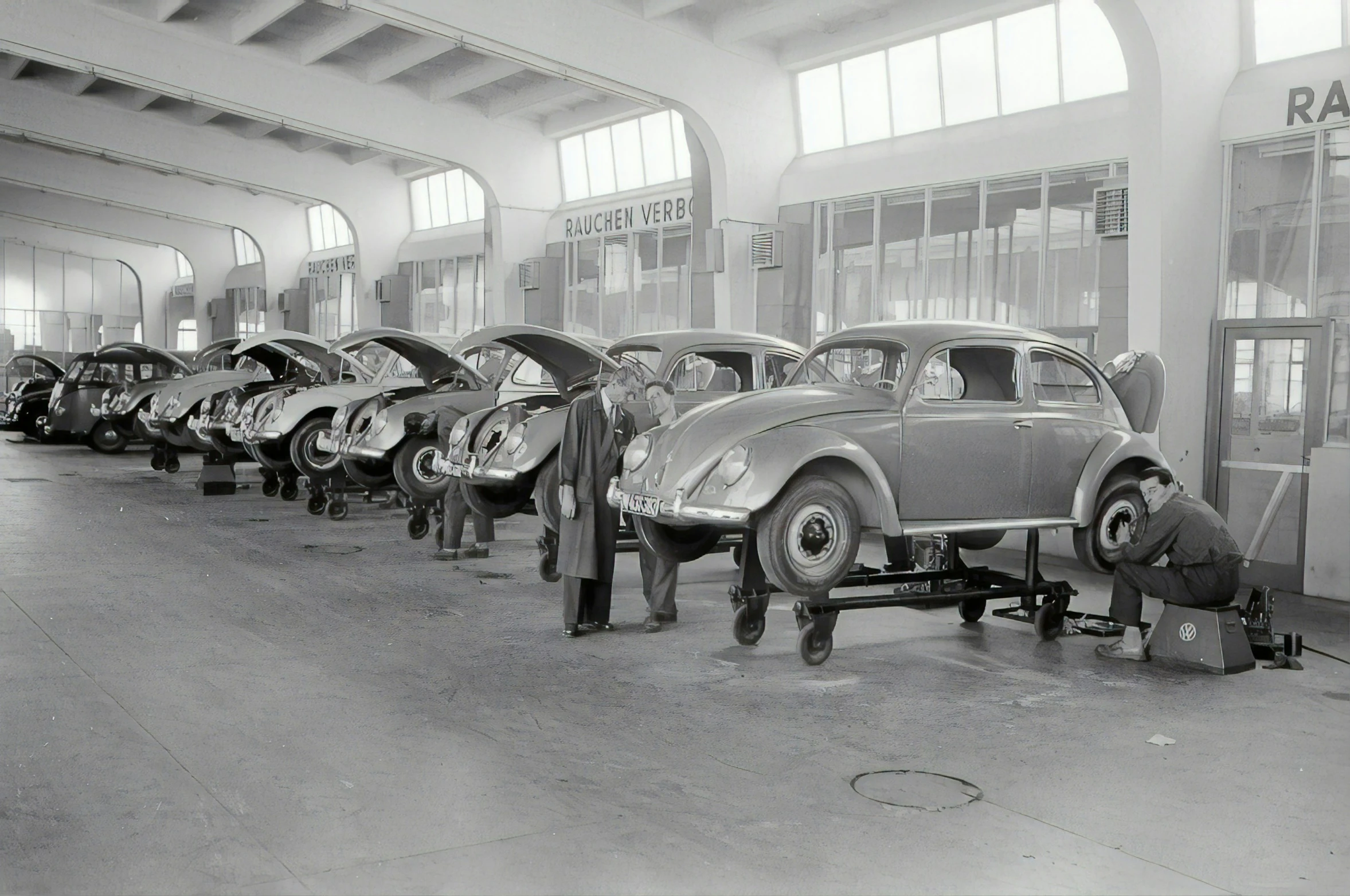 this black and white po shows several old cars