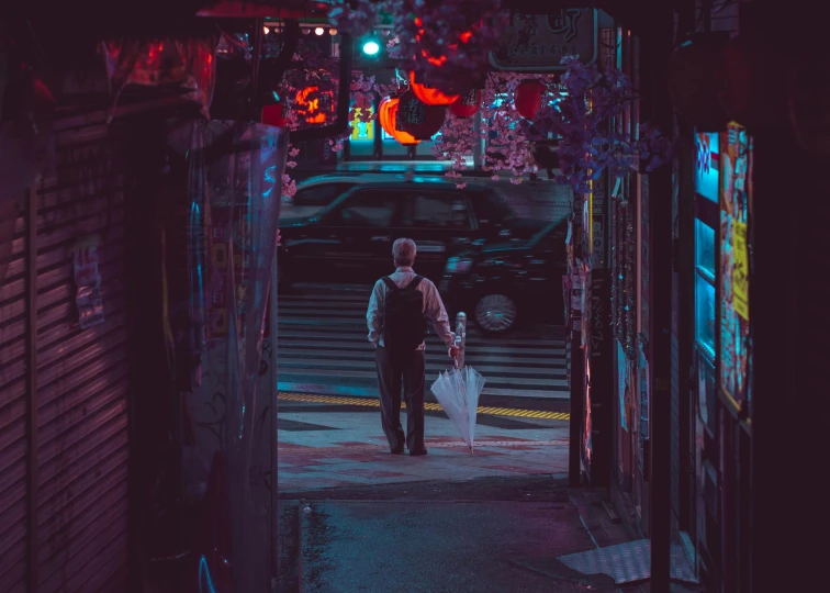 a man and woman walking down a dark street