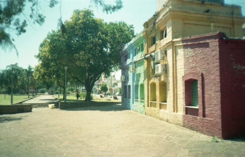 an old town sidewalk, with a building in the foreground