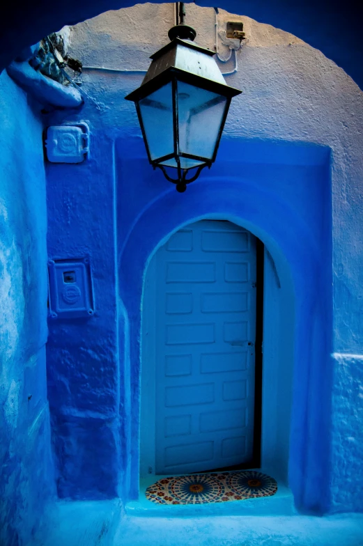 a lamp is on outside a building in morocco