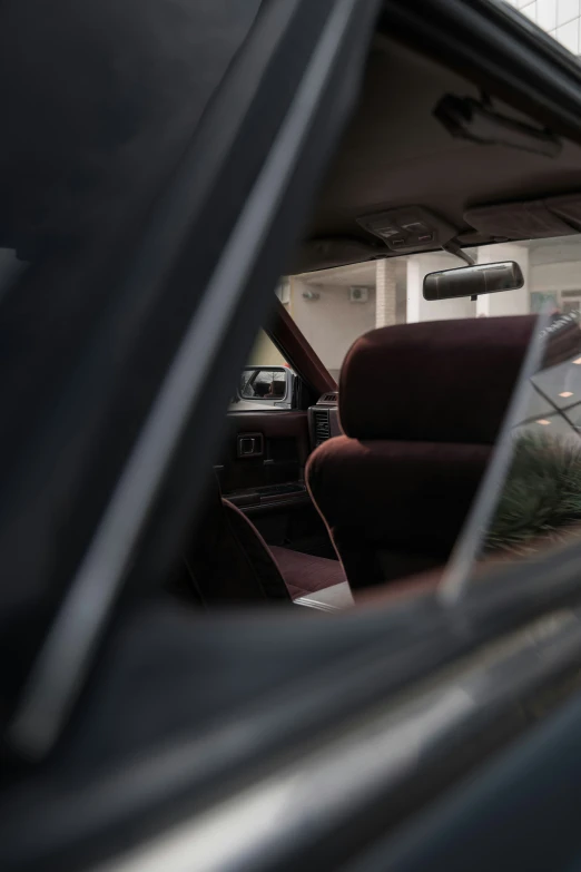 the view from inside of a car of a truck