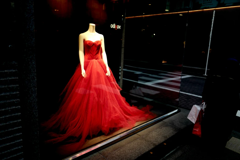 an evening gown displayed in a display case