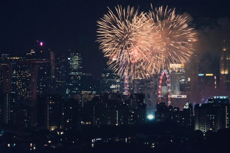 fireworks are lit up the sky above a city