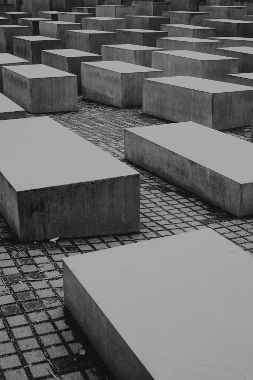 a large group of white stones with one piece of concrete placed on them