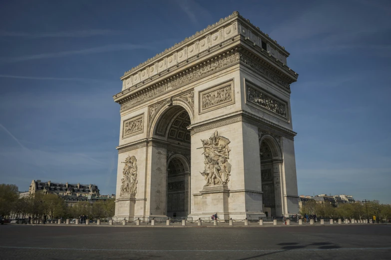 a large, tall monument stands in a park