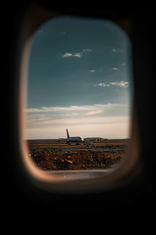 an airplane is in the middle of an open field