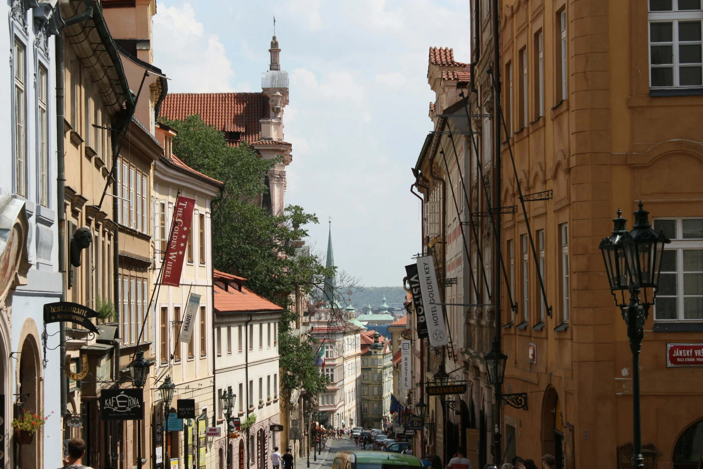 a narrow city street with buildings on either side