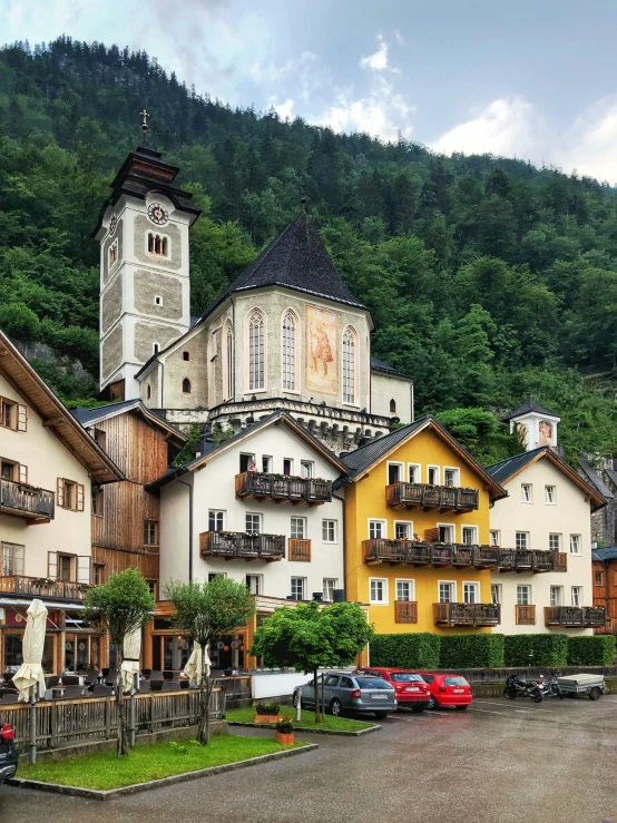 a small town with a church, and a clock tower