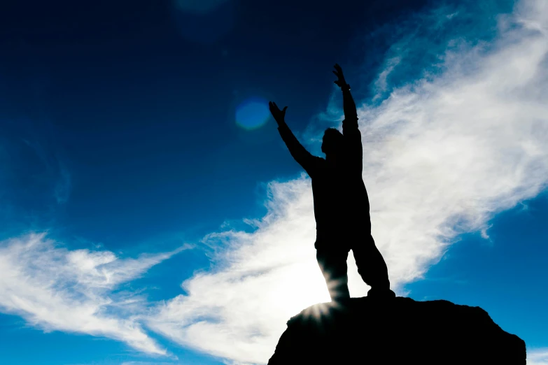 a person standing on top of a rock