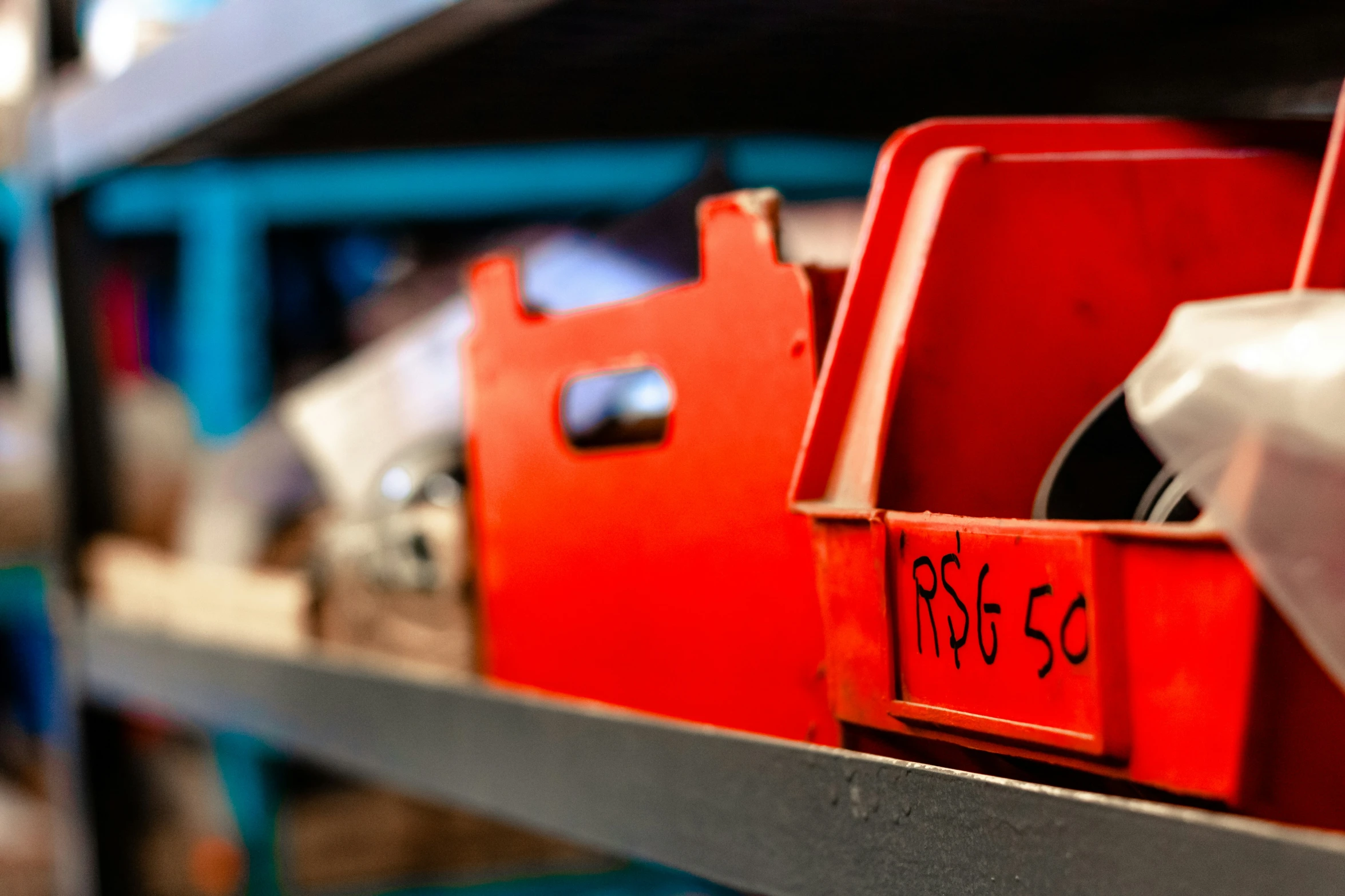 close up of red storage boxes on a shelf