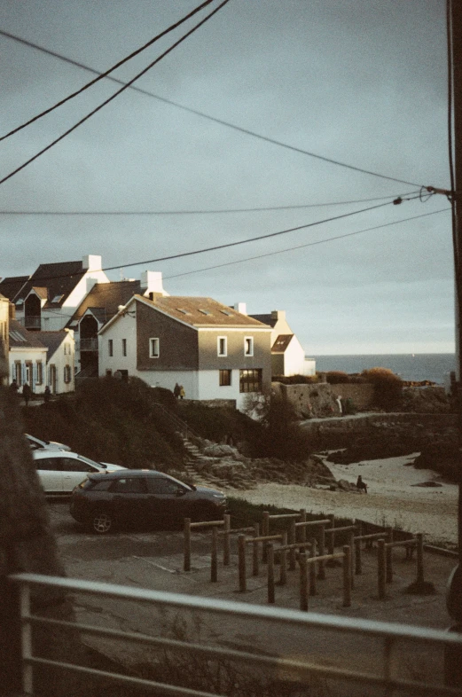 the ocean is beside the street and buildings