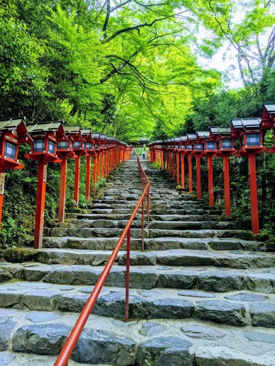 the steps are lined with lanterns along the pathway