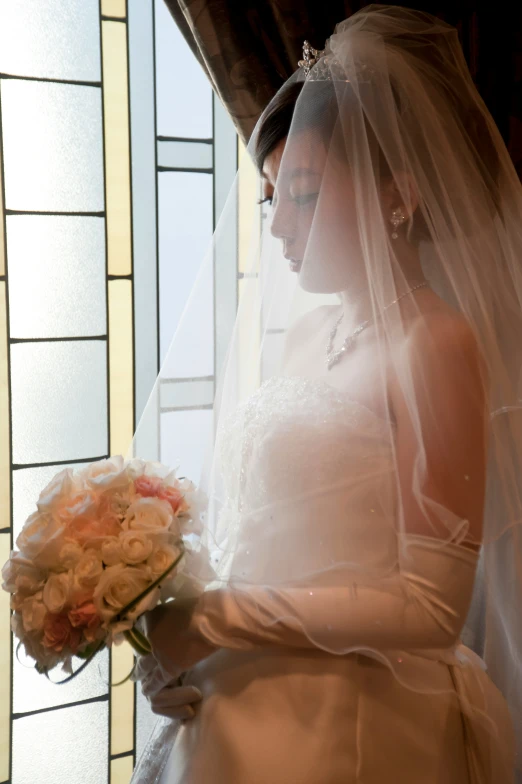 a person in a wedding dress with a bouquet