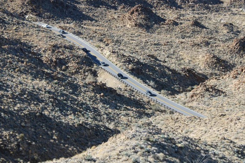 a view of a winding road that is in the middle of nowhere