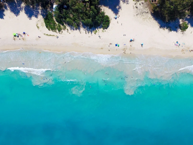 people are relaxing on the sand in an ocean