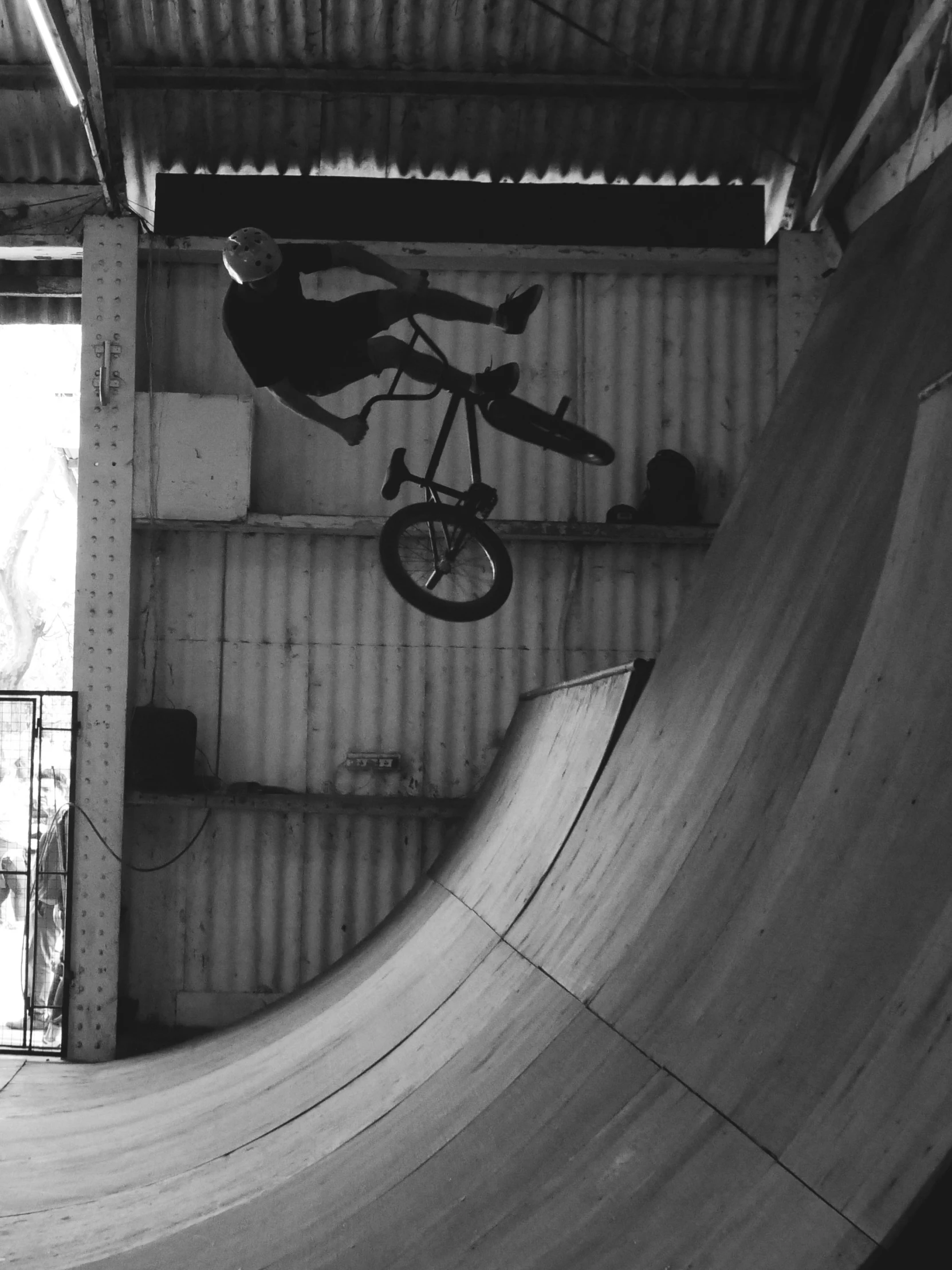 a person doing a trick on a skateboard in a skate park