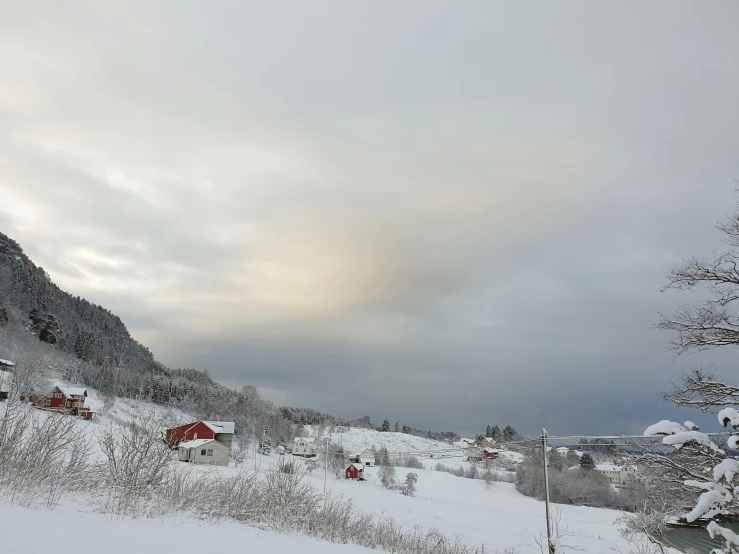 a view of a rural landscape covered with snow