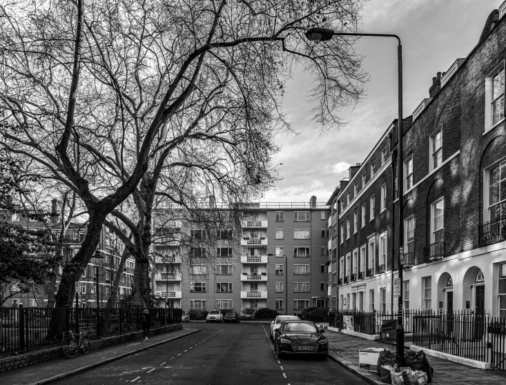 black and white pograph of cars and buildings