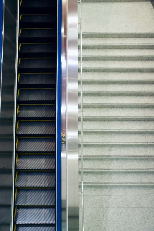 two escalators are standing in a row