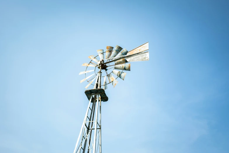 a large wind mill on the corner of a building