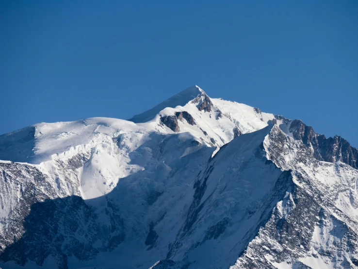 an extreme s of a snowy mountain side