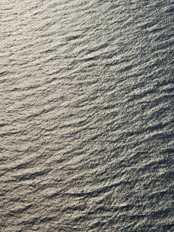 there is a black and white pograph of people on a surfboard