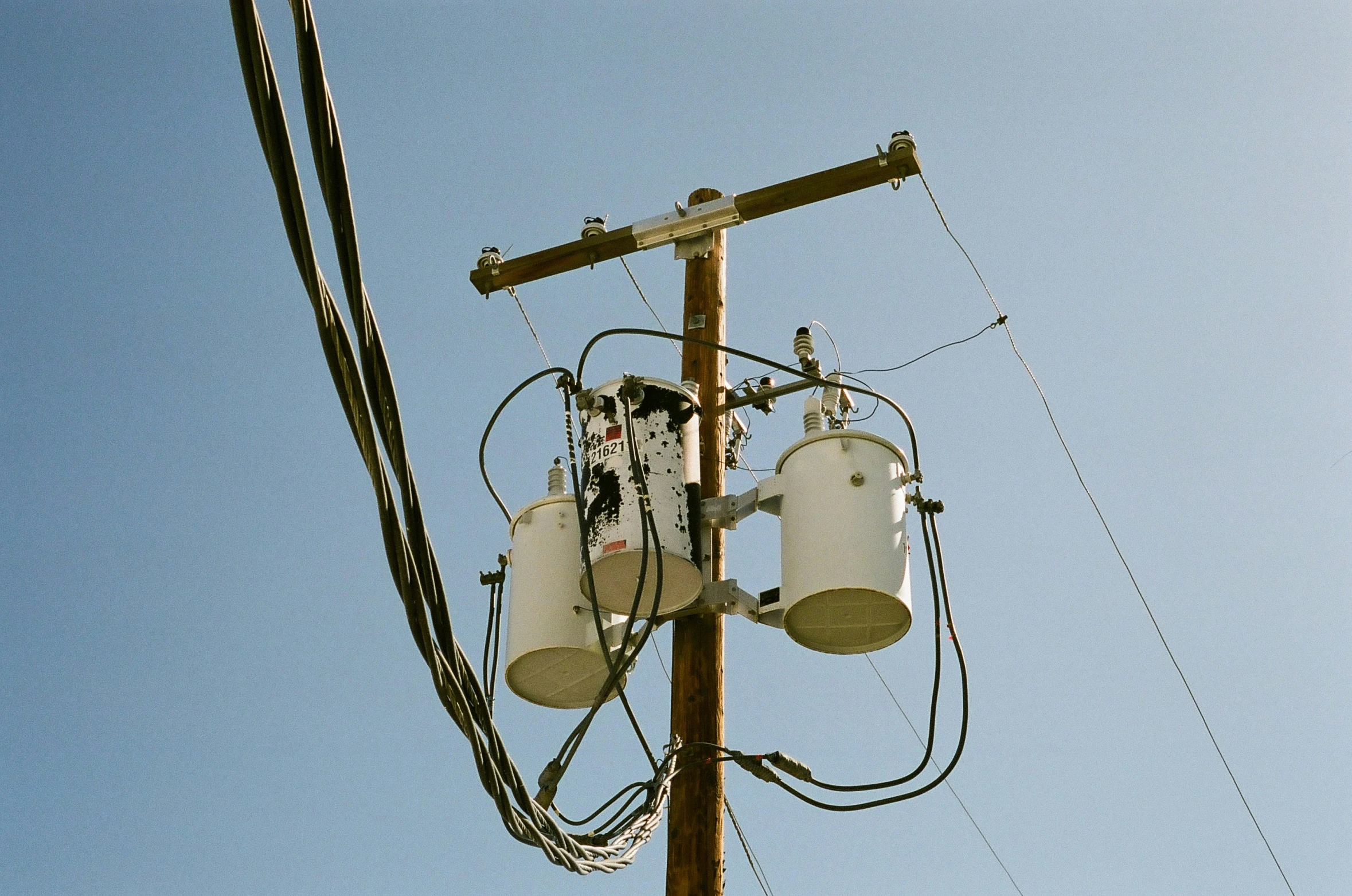 a phone tower with three cell phones on top