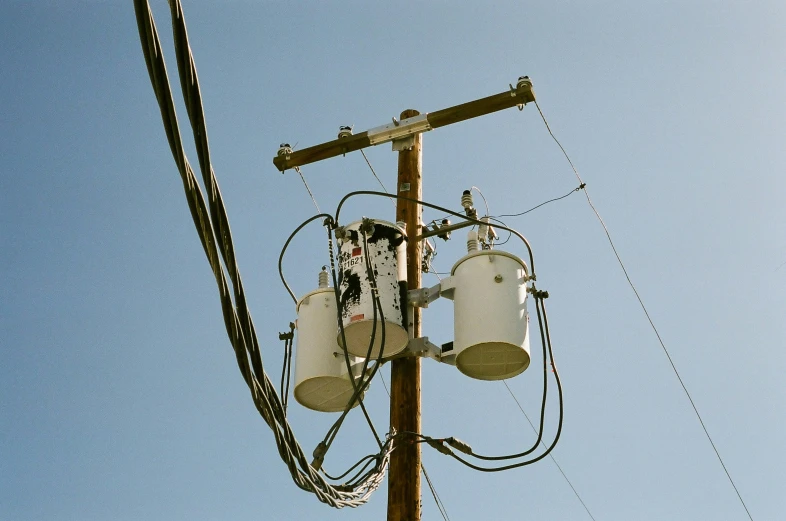 a phone tower with three cell phones on top