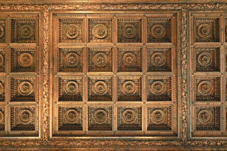 the ceiling of a room has many square designs