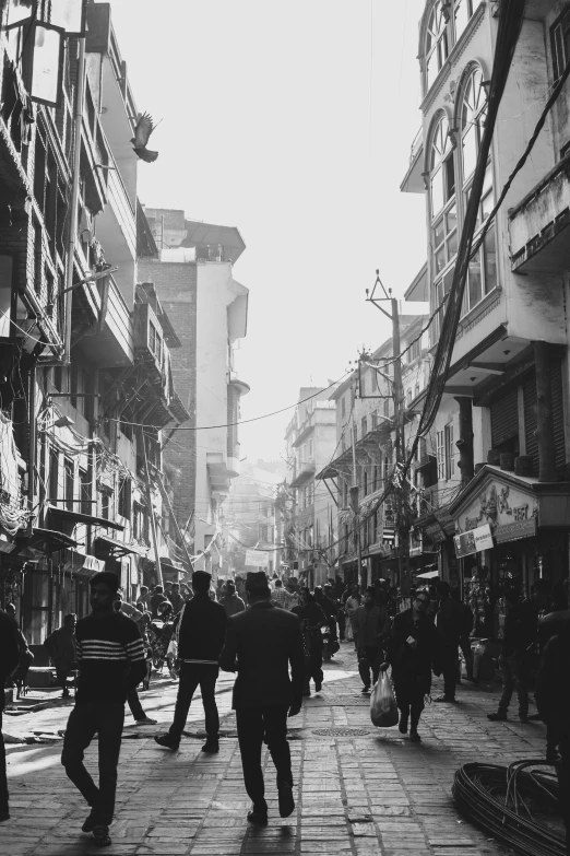 people are walking on a city street