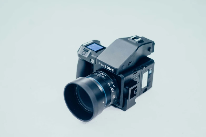 a camera lens sitting on top of a white surface