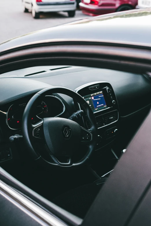 the dashboard of a car next to a bunch of other cars