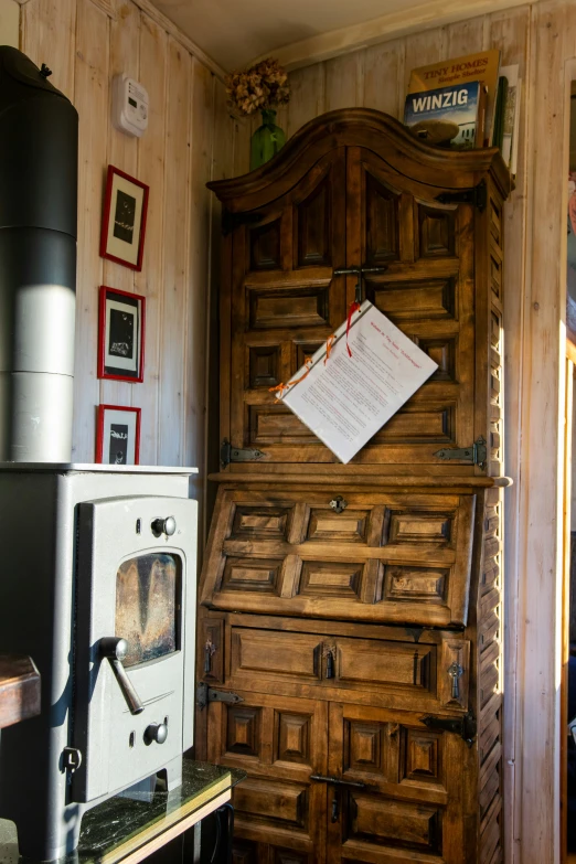 the room has a large old fashioned stove in it