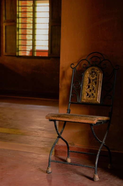 a chair sitting on top of a wooden table