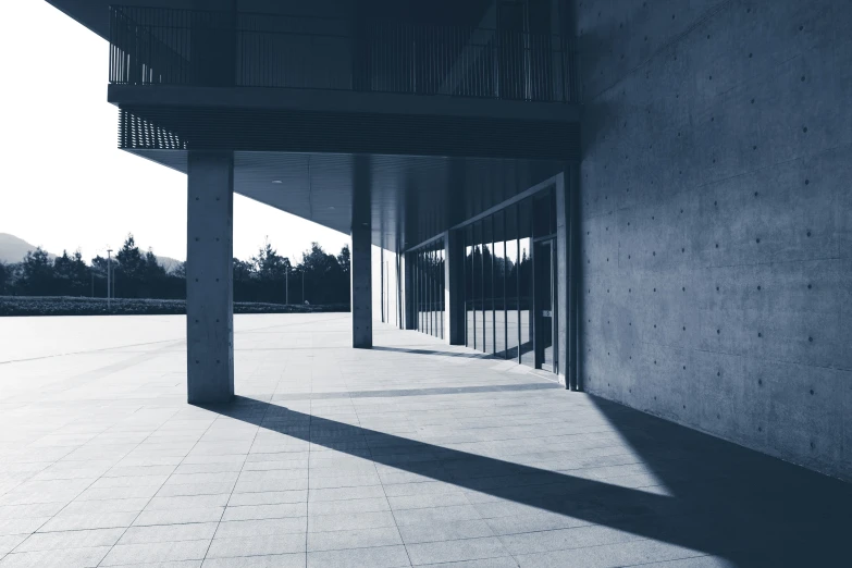 empty parking spaces near a building in black and white