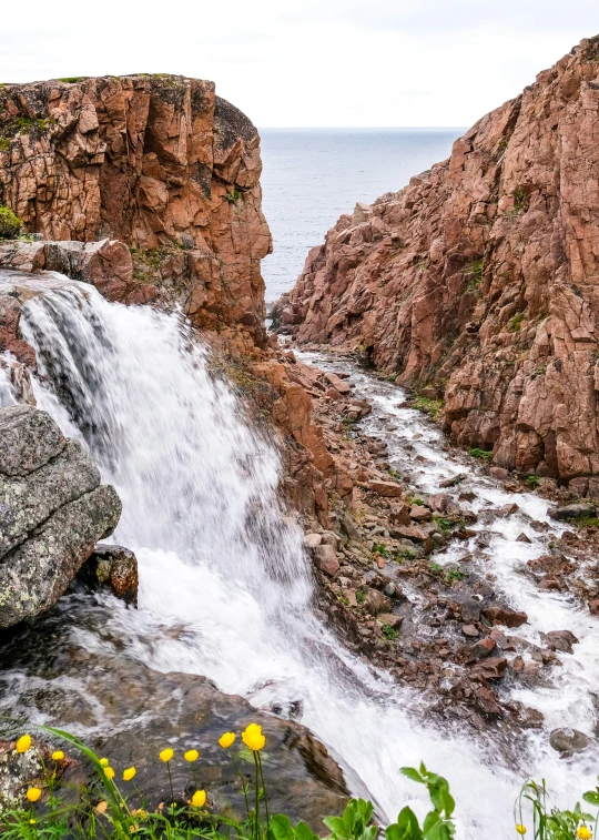 there are a few large rocks and water