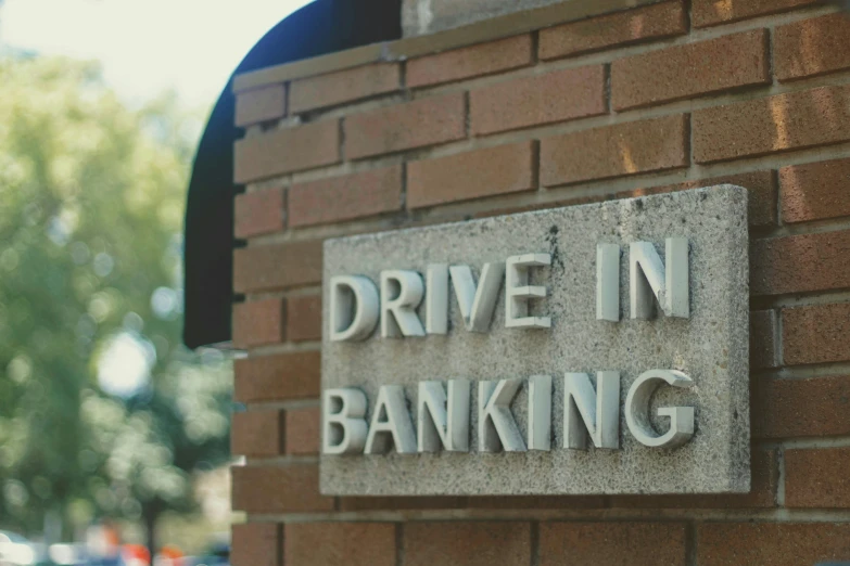 a brick sign that says drive in banking