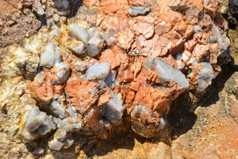 rocks and stones covered in white gray and orange colors