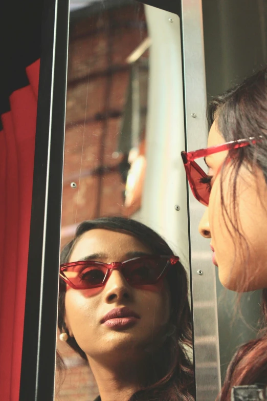 a close up of a person wearing sunglasses