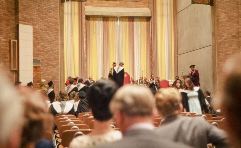 a couple dressed in wedding attire stand together at the altar in a church